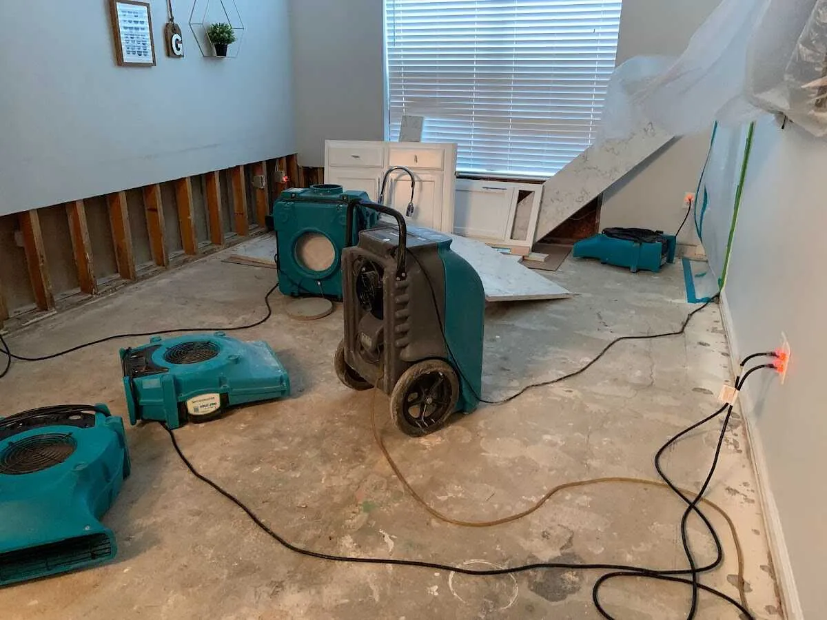 Dehumidifier in flood-cut room for Water Damage Restoration in Garfield